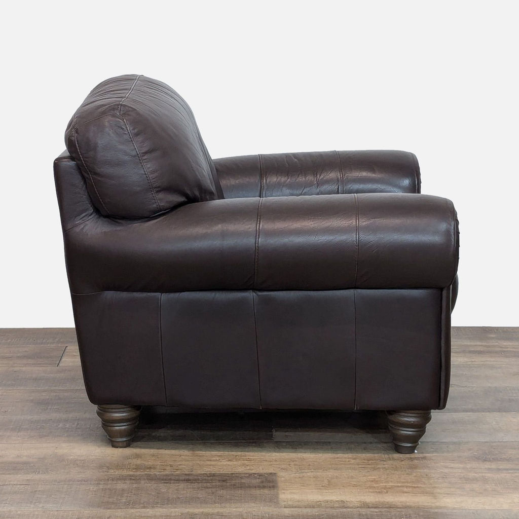 Side view of Natuzzi chair showcasing leather upholstery and elegant arm design.