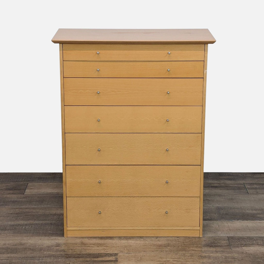 Wooden dresser with seven drawers, metal glides, and a natural finish.
