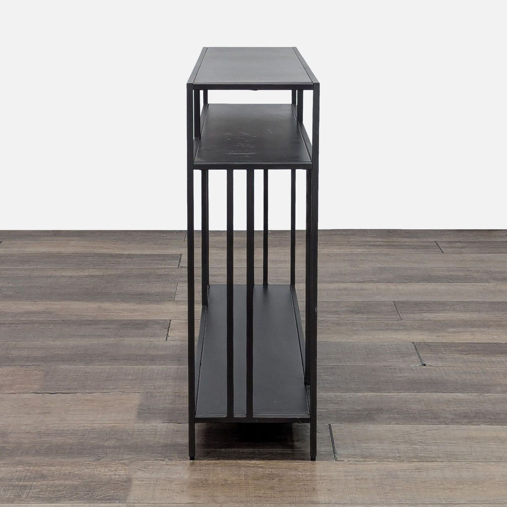 Modern black table with open shelving, perfect for entryways.
