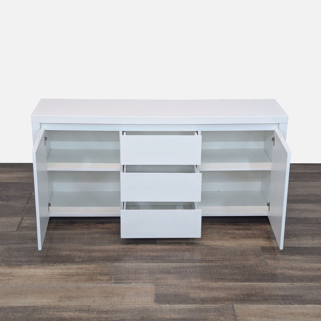 Open Reperch credenza showing interior shelves and three pull-out drawers. 