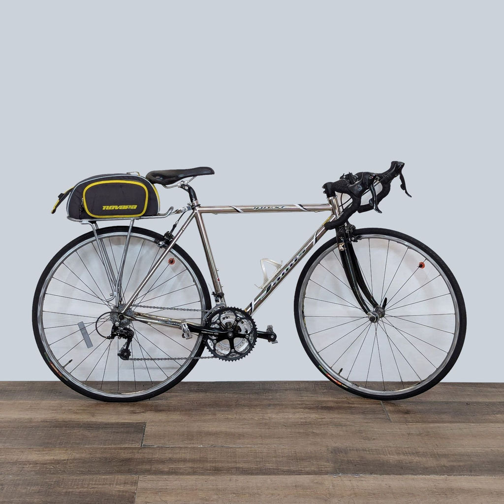 Jamis Road Bike with lightweight frame and storage bag for essentials.