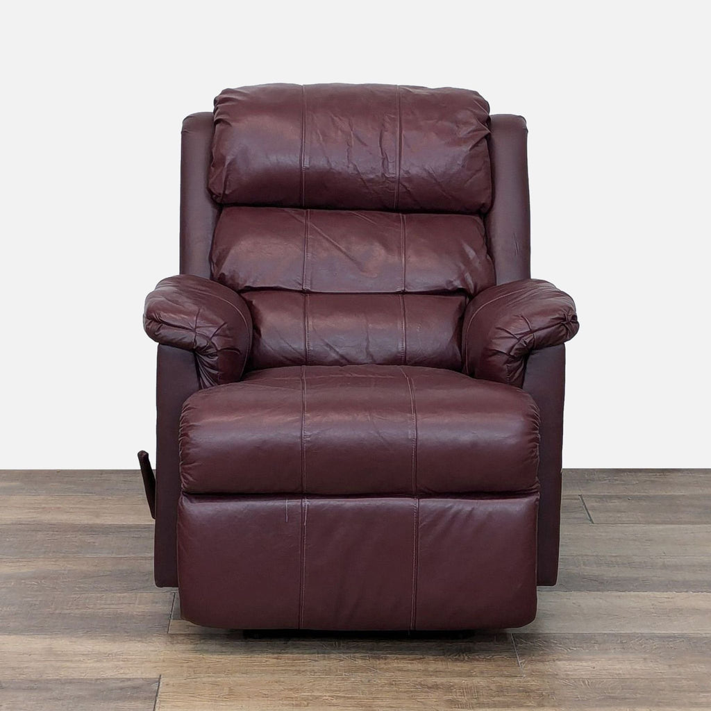 Front view of leather Barcalounger recliner on wooden floor.