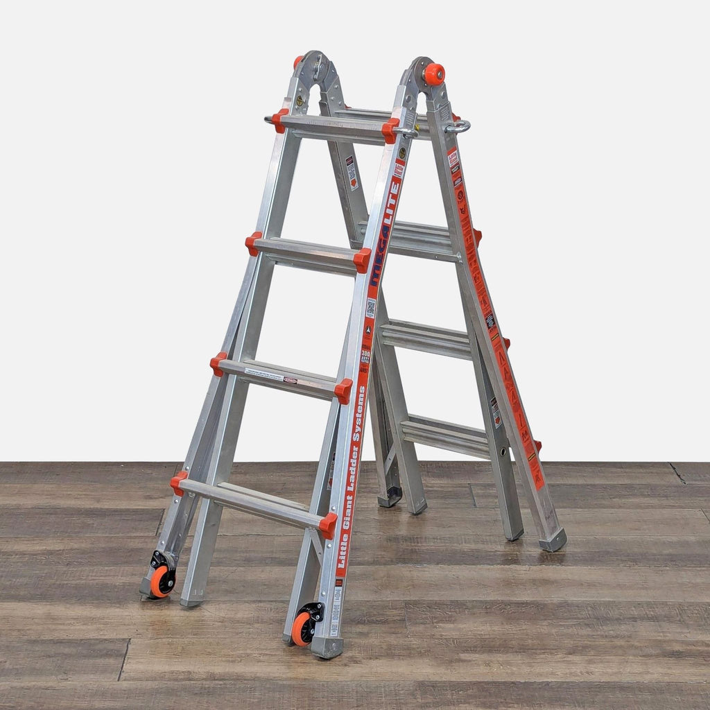 Little Giant Megalite Aluminum Ladder in A-frame configuration on wooden floor.