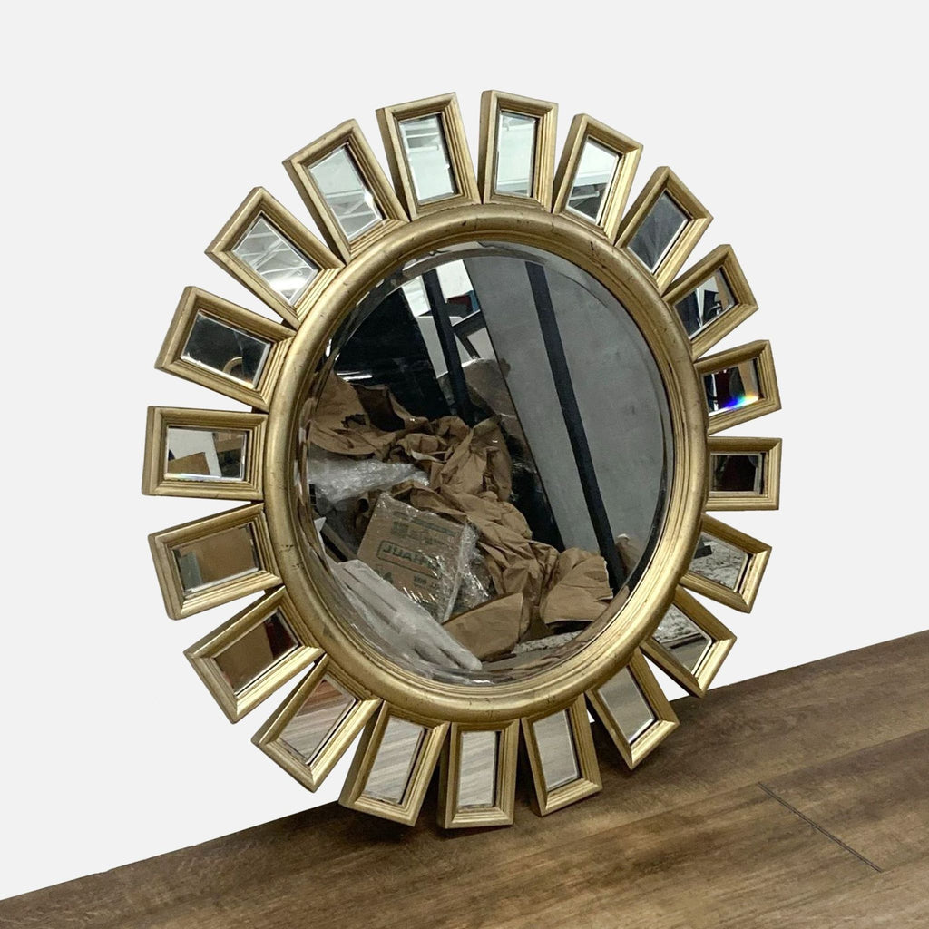 Decorative Reperch mirror in a circular design, with mirrored frame pieces around the edge.