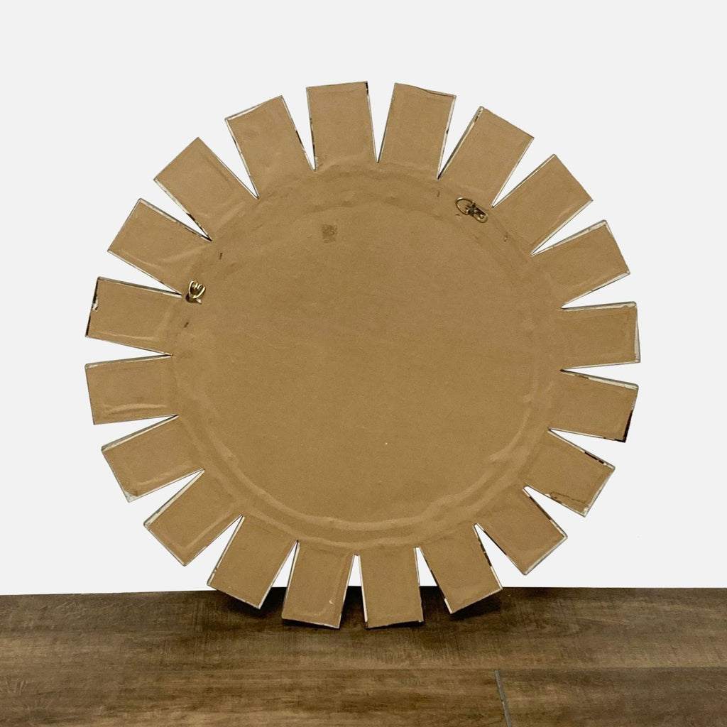 Back view of Reperch's round mirror with cardboard backing and inset mirror design visible.