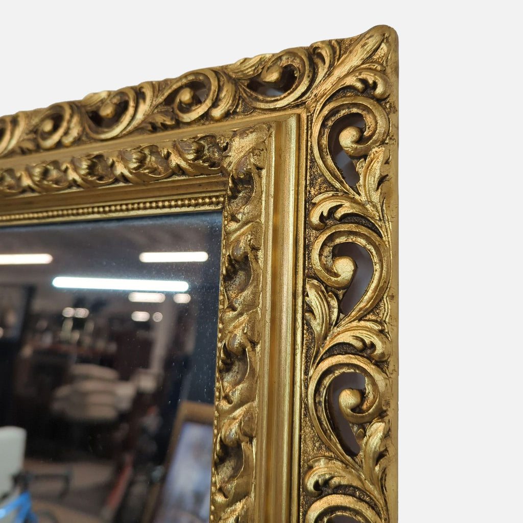 Close-up of an ornate gold pattern on the Reperch mirror frame, showcasing intricate craftsmanship.