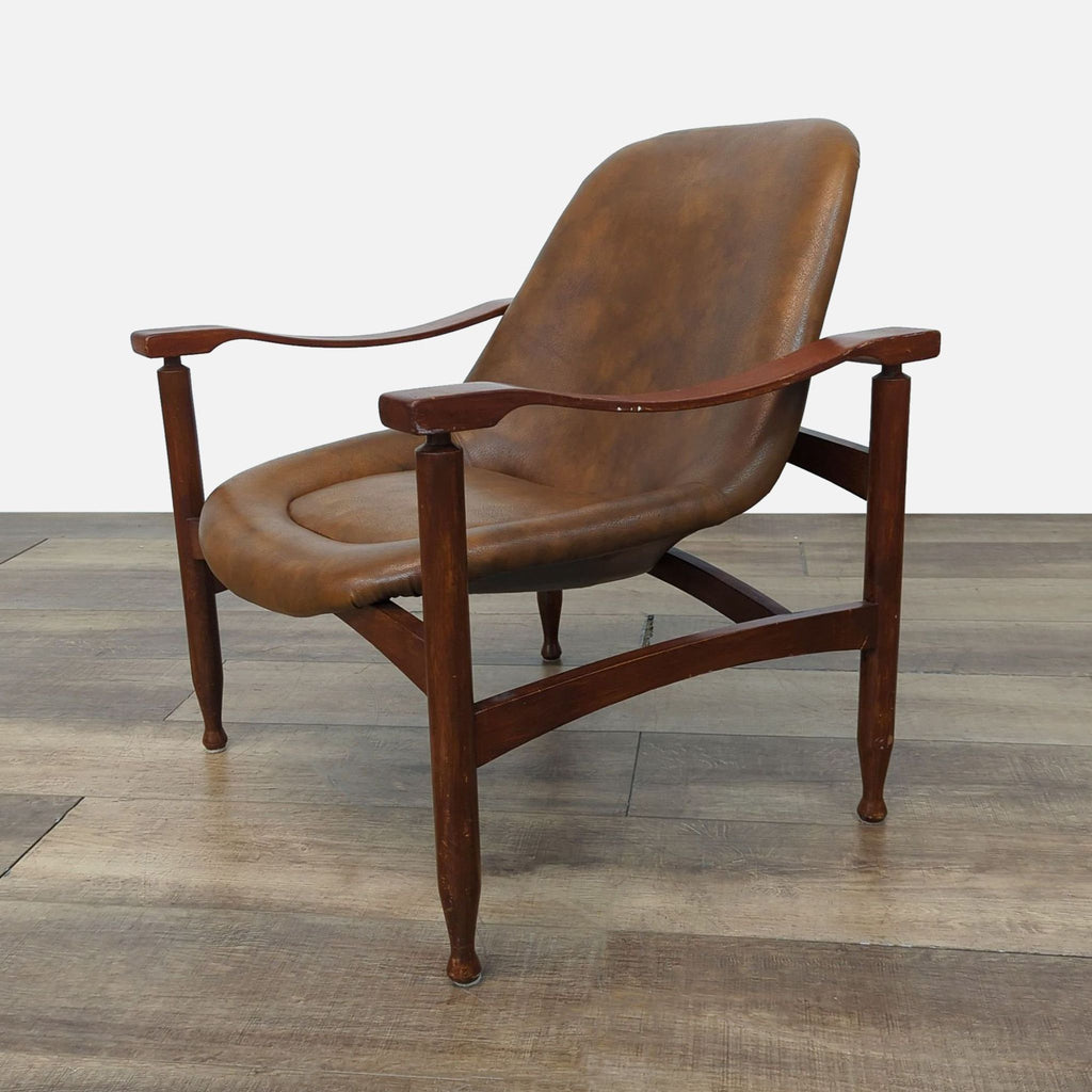 Side angle of vintage Busnelli armchair, showcasing wood construction and brown leather seat.