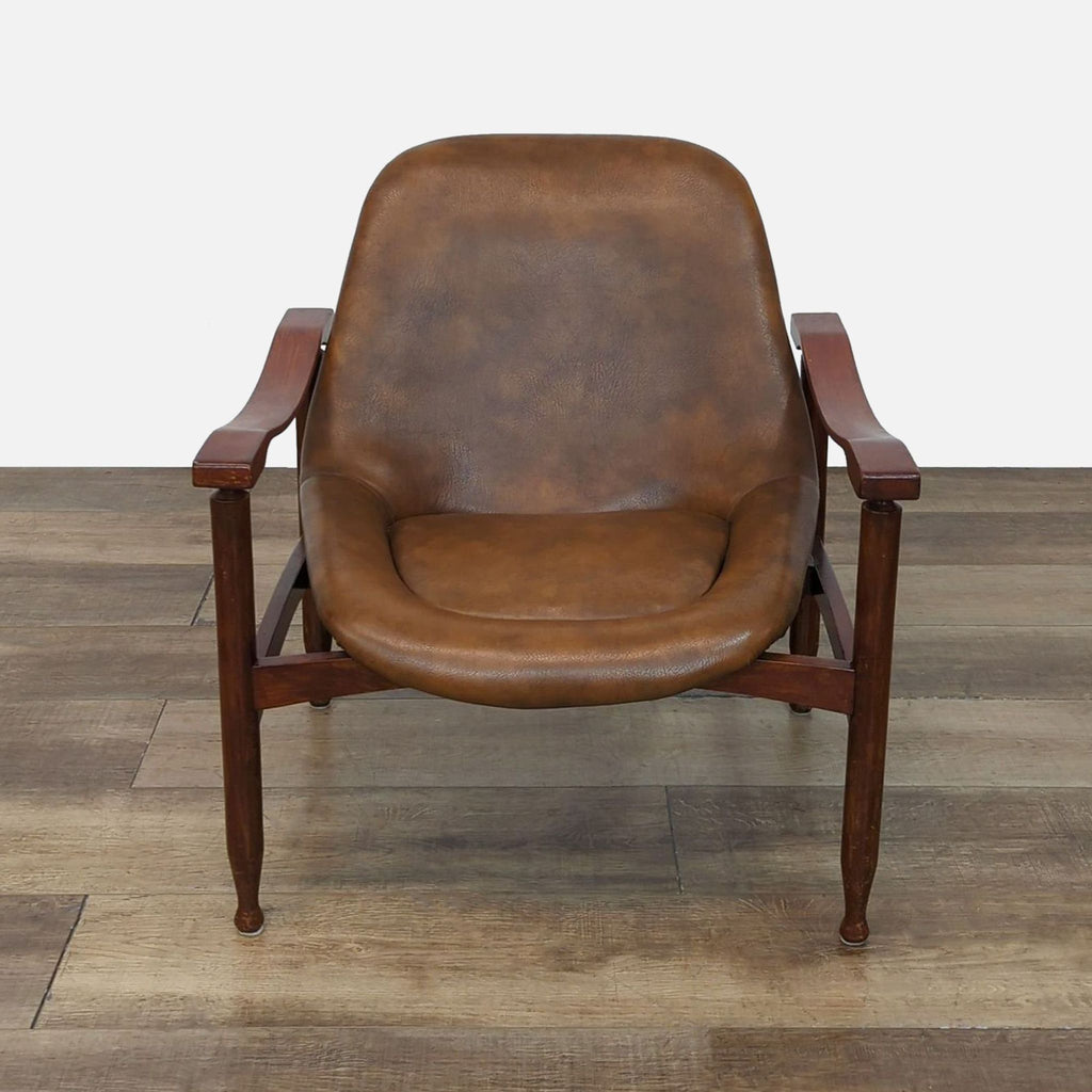 Front view of 1950s Italian Busnelli lounge chair with wood frame and leather seat.