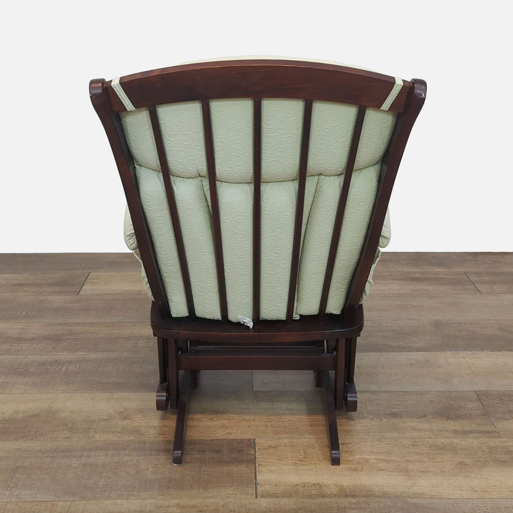 Back view of a wooden frame glider chair in the lounge category.