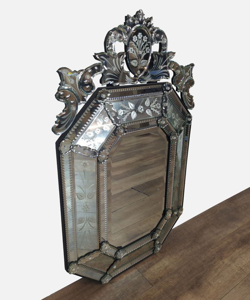 Elegant side view of an intricate Reperch mirror with floral designs and decorative trim.