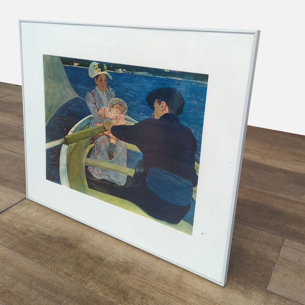 Close-up view of "The Boating Party" print in a white frame.