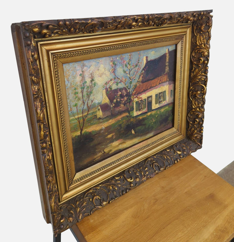 Side view of Reperch oil painting with intricate gold framing and peaceful cottage landscape.