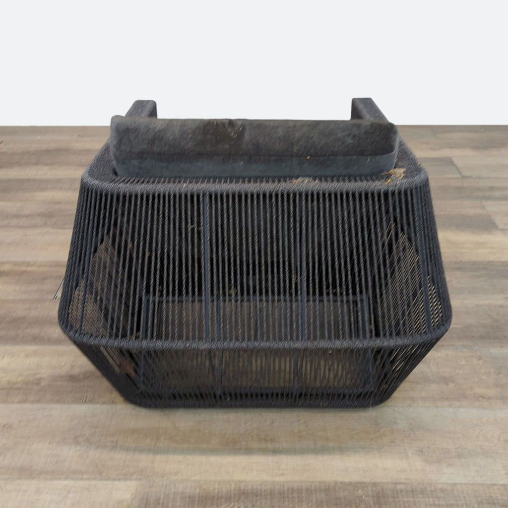 Rear view of Holly Hunt Scarab chair showing its angled, open-weave black frame and suspended seat design.