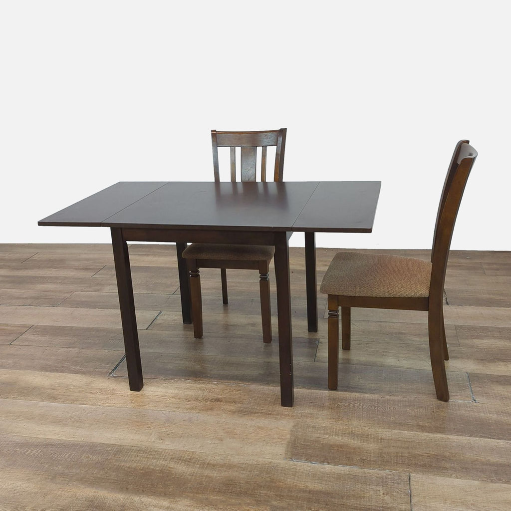 Elegant drop leaf table with upholstered seat chairs, Reperch brand.