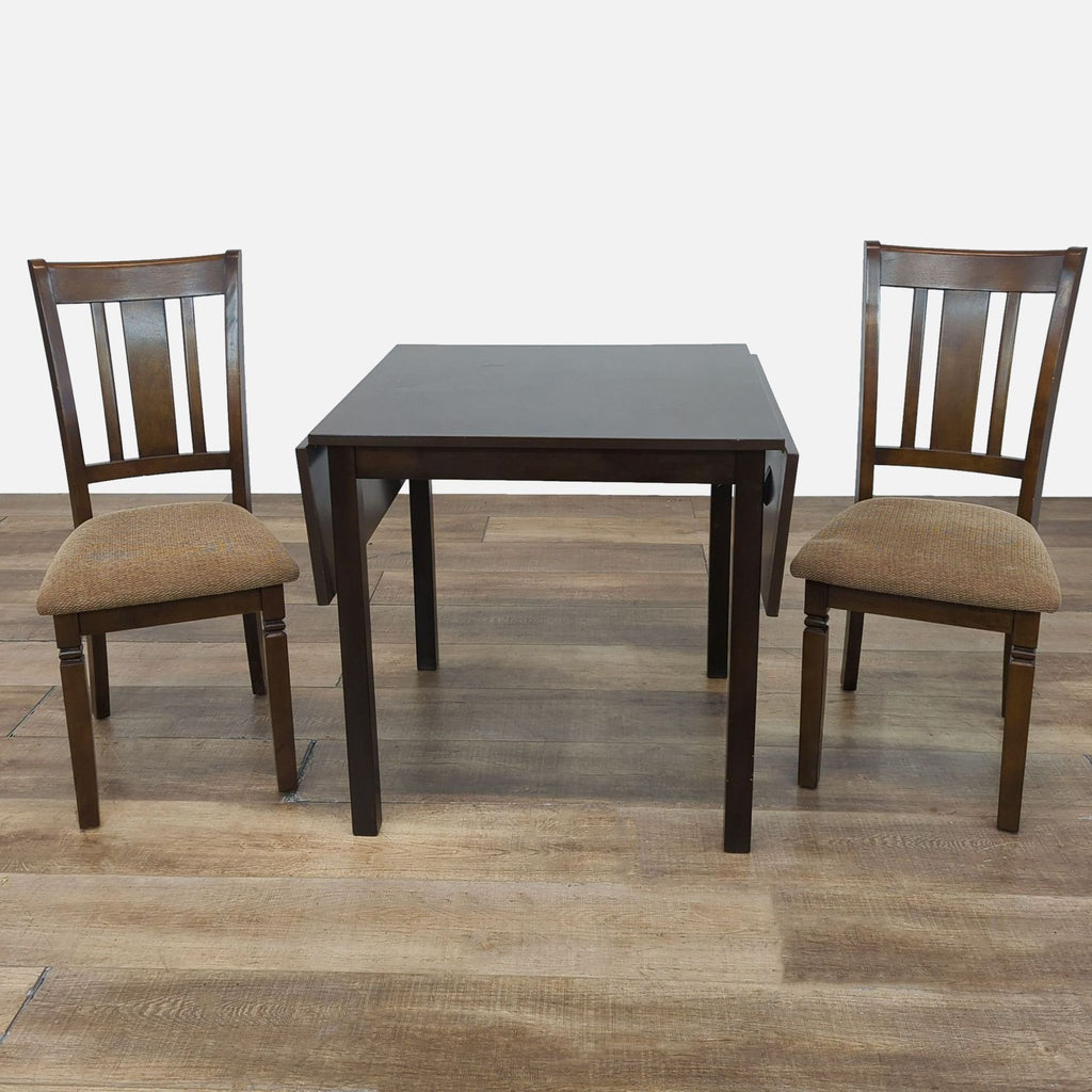 Reperch dining set with drop leaf table and two slat back chairs.