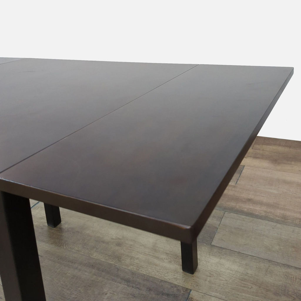 Close-up of the Reperch drop leaf dining table surface.