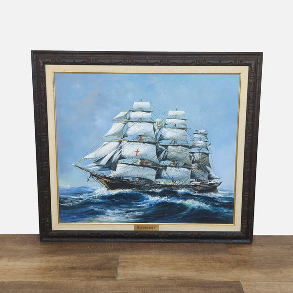 Painting of clipper ship "Dreadnought" on sea, in ornate wood frame with brass nameplate.