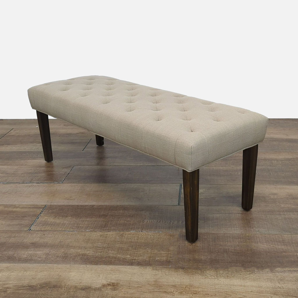 Elegant bench in beige fabric, ideal for any space.
