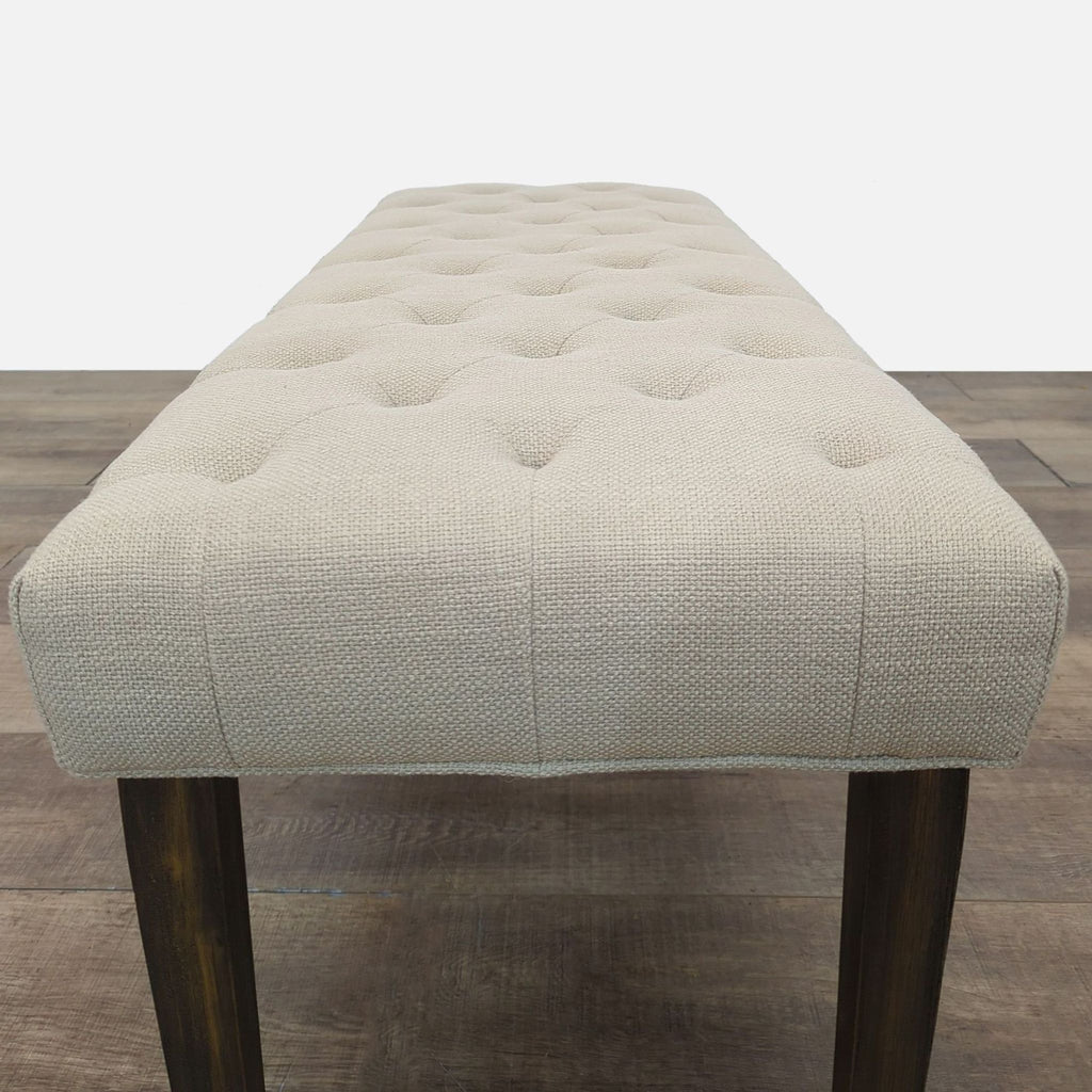 Classic linen-like bench with tufting and sturdy legs.