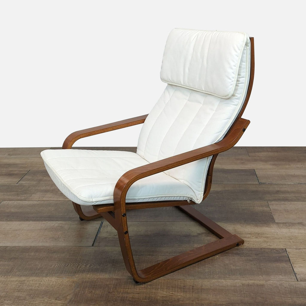 Side view of IKEA POÄNG chair with bentwood structure and white padded seat.