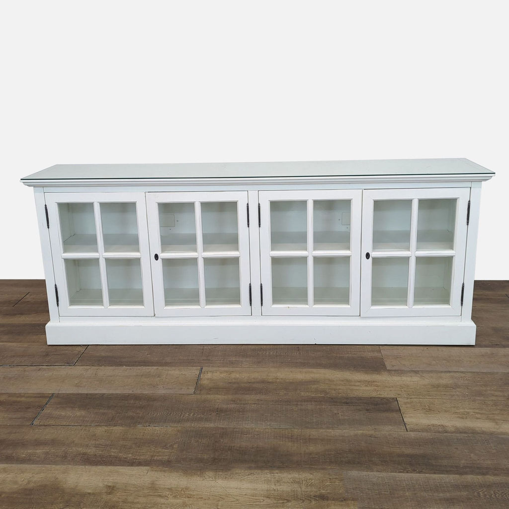 White sideboard with glass doors and top; keys missing.