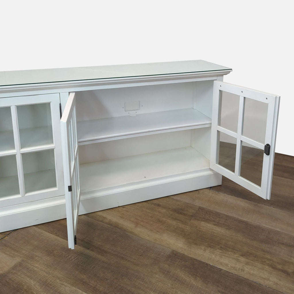 Open white sideboard showing interior shelves; keys missing.