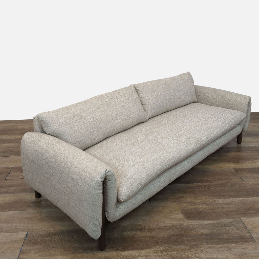 Side view of a Reperch 3-seat sofa, featuring subtle textured fabric and a modern design with wooden legs.
