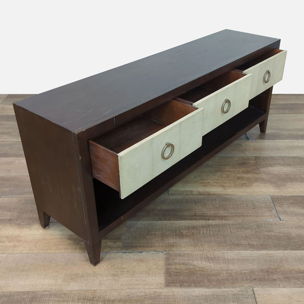 Credenza with open drawers, wooden frame, shagreen finish, and metal ring pulls.