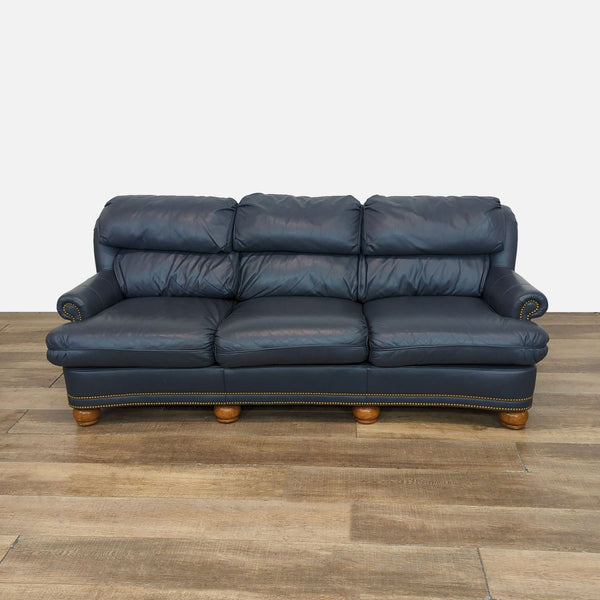 Thomasville leather sofa with rolled arms and brass nailhead trim.