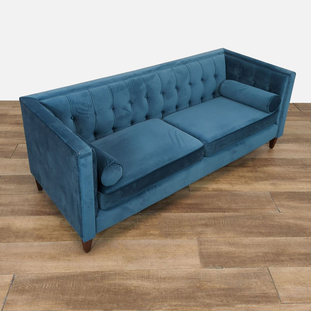 Angled view of Jennifer Taylor Home three-seat sofa, featuring medium-firm reversible cushions.