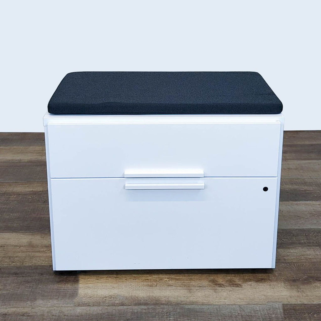 1. Reperch white storage bench with black cushion, two drawers, lock keys not included, placed on wood floor.