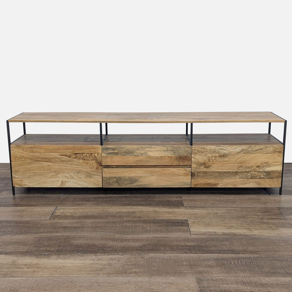 Mango wood entertainment center with blackened steel legs, front view with closed drawers.