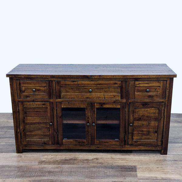 Rustic wood entertainment center with multiple drawers and glass doors by Jofran.