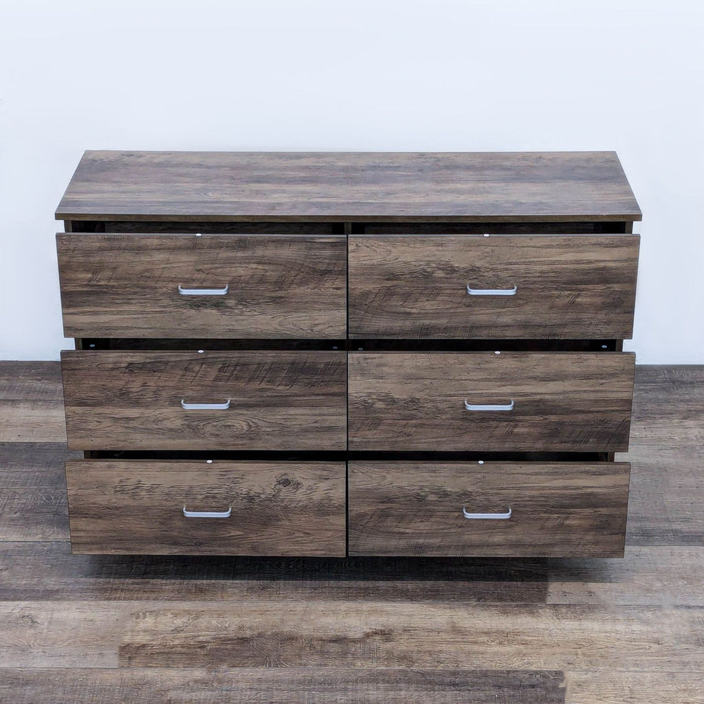 Wooden dresser with metal glides and handles, showcasing 6 partially open drawers.