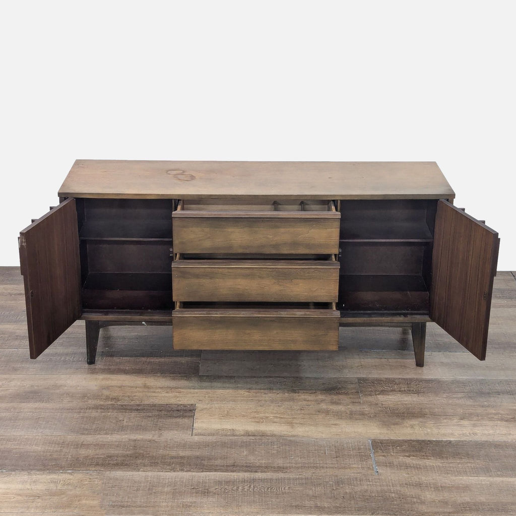 Open Reperch credenza showing spacious shelves and three central drawers for storage.