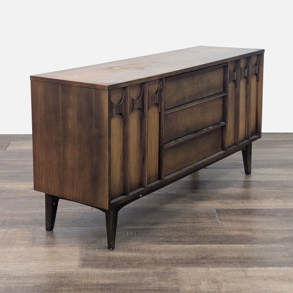 Angled view of Reperch sideboard highlighting its sleek design and decorative side panels.
