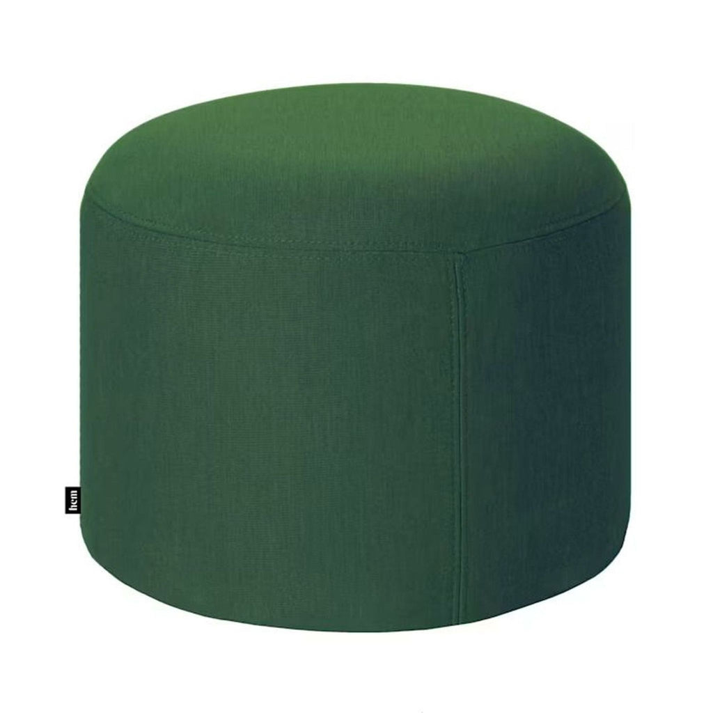 Green cylindrical ottoman from Hem, featuring a smooth fabric design.