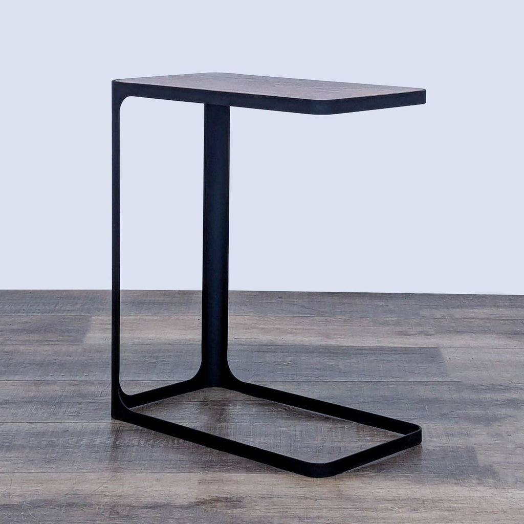 Minimalist side table with wood top and steel frame, by Yamazaki.