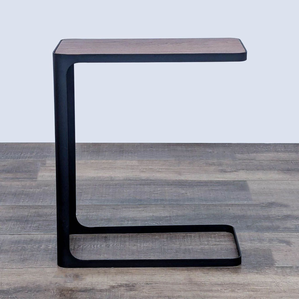Contemporary Yamazaki steel-framed table with wooden tabletop.