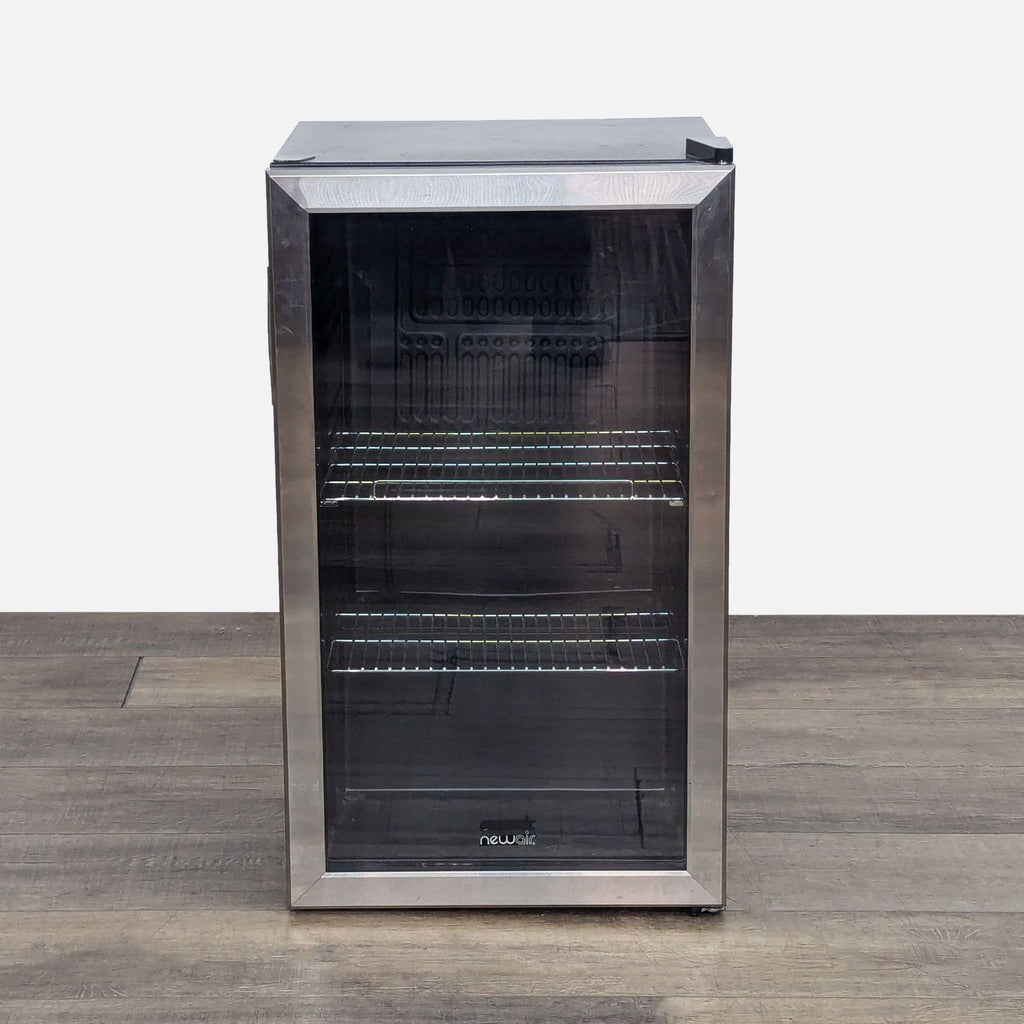 NewAir Compact Beverage Refrigerator with glass door and adjustable shelves.