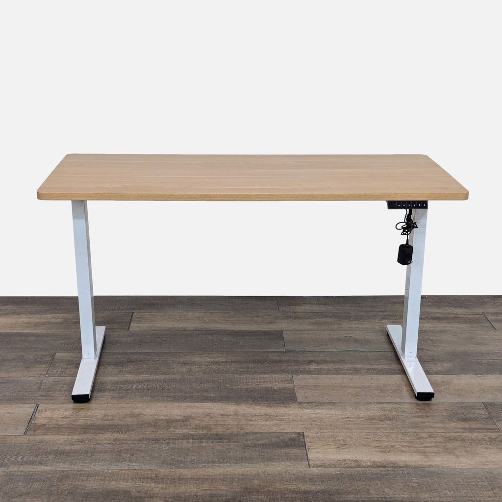 FLEXISPOT desk with adjustable height and wood top.