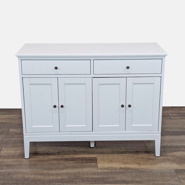 1. White sideboard with two drawers and four doors, featuring a sleek design by IKEA.