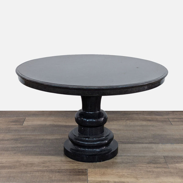 48-inch round black granite table with single pedestal base, shown in category Tables.
