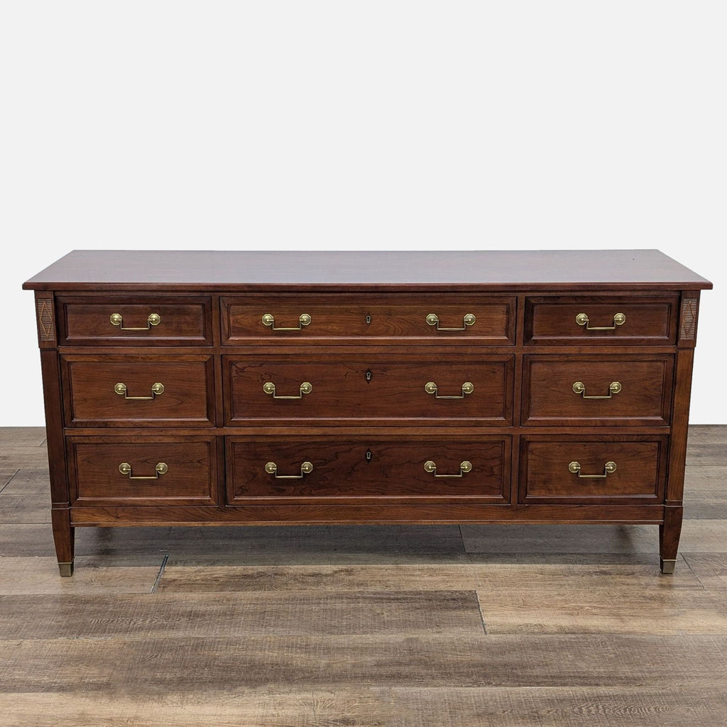 Cherry wood dresser with brass handles, by Reperch, featuring dovetail drawers.  