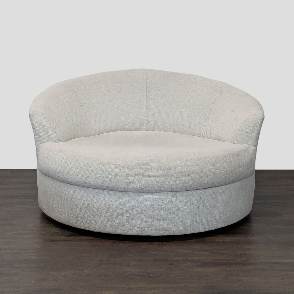 Round lounge chair with light beige boucle upholstery, wide seat, curved backrest; by Ashley Furniture.  