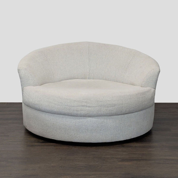 Round lounge chair with light beige boucle upholstery, wide seat, curved backrest; by Ashley Furniture.  