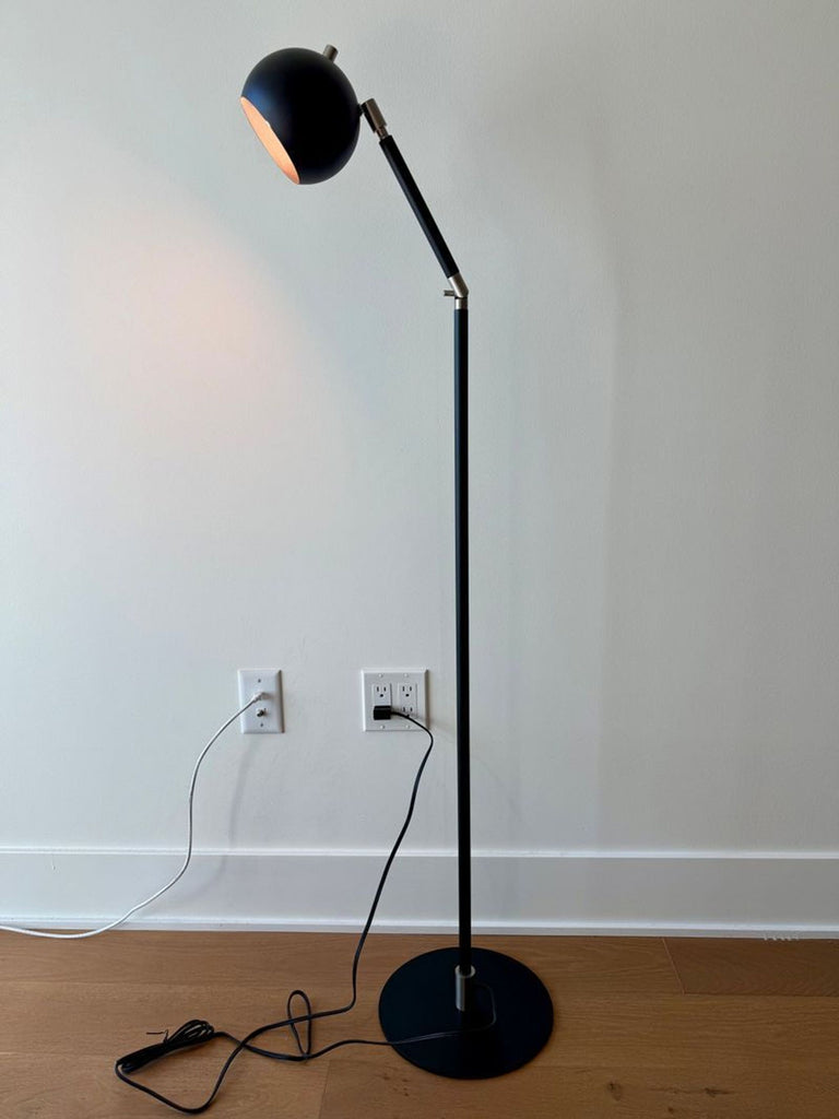 Black modern Camber floor lamp with round base, tall slim stem, and drum shade, perfect condition.