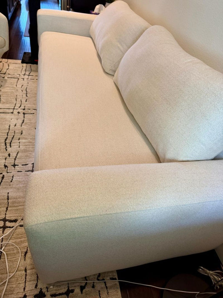 1. Modern 3-seat Living Spaces sofa in a neutral color, perfect for contemporary living rooms.  
