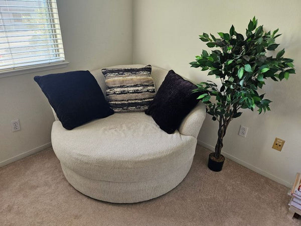 1. Cream boucle oversized round swivel cuddler chair in excellent condition from Ashley Homestore.  