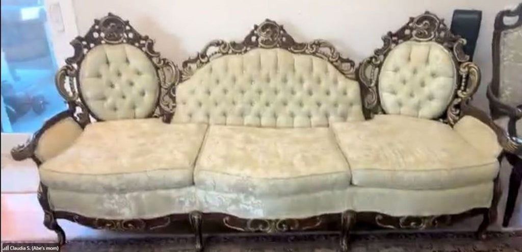2. Ornate Hausske-Harlen 3-seat sofa with carved wood frame and light tufted upholstery in a living room.  